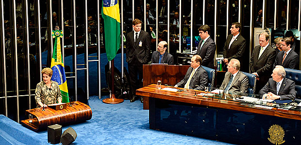 Suspended Brazilian President Dilma Rousseff (L) delivers her speech during the impeachment trial, at the National Congress in Brasilia, on August 29, 2016. Rousseff arrived at the Senate to defend herself confronting her accusers in a dramatic finale to a Senate impeachment trial likely to end 13 years of leftist rule in Latin America's biggest country. / AFP PHOTO / EVARISTO SA ORG XMIT: ESA436