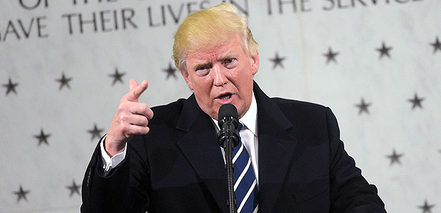 US President Donald Trump speaks at CIA Headquarters in Langley, Virginia, on January 21, 2017. Trump told the CIA Saturday it had his fervent support as he paid a visit to mend fences after publicly rejecting its assessment that Russia tried to help him win the US election. "I am with you 1,000 percent," Trump said in a short address to CIA staff after his visit to the agency headquarters in Virginia. / AFP PHOTO / MANDEL NGAN ORG XMIT: MNN027