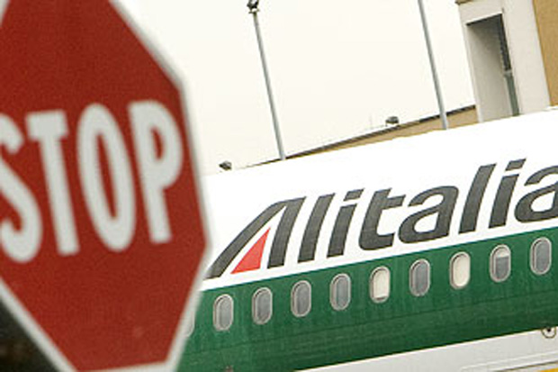 An Alitalia airplane is parked at Fiumicino airport near Rome September 19, 2008. Italy's civil aviation authority ENAC will ground Alitalia flights in 7-10 days from next Monday if the special administrator does not present a new rescue plan to them that day, a source at ENAC said on Friday. REUTERS/Tony Gentile (ITALY) 