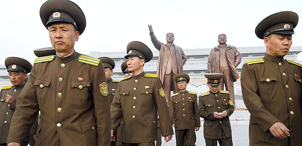 North Korean soldiers walk in front of bronze statues of North Korea's late founder Kim Il-sung and late leader Kim Jong Il at Mansudae in Pyongyang, in this photo released by Kyodo April 25, 2017, to mark the 85th anniversary of the founding of the Korean People's Army. Mandatory credit Kyodo/via REUTERS ATTENTION EDITORS - THIS IMAGE WAS PROVIDED BY A THIRD PARTY. EDITORIAL USE ONLY. MANDATORY CREDIT. JAPAN OUT. NO COMMERCIAL OR EDITORIAL SALES IN JAPAN. TPX IMAGES OF THE DAY ORG XMIT: TOK002