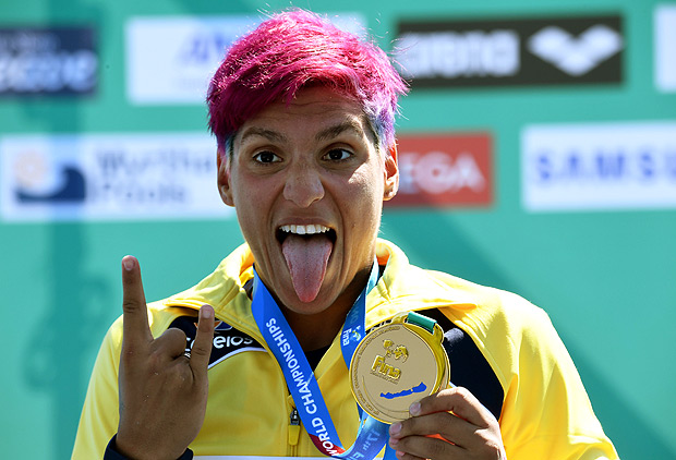 Gold medalist Brazil's Ana Marcela Cunha celebrates her victory on the podium after the women's 25 km open water swimming event at the 2017 FINA World Championships in Balatonfured on July 21, 2017. / AFP PHOTO / ATTILA KISBENEDEK ORG XMIT: ATT804