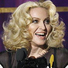 Singer Madonna is seen on stage as she is inducted during the 23rd annual Rock and Roll Hall of Fame induction ceremony at the Waldorf Astoria Hotel in New York March 10, 2008. REUTERS/Lucas Jackson (UNITED STATES) 