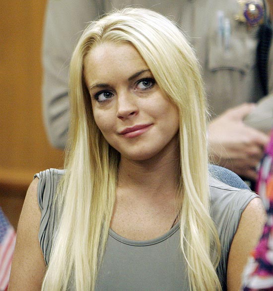 FILE -- A July 20, 2010 file photo shows Lindsay Lohan in a court in Beverly Hills, Calif., where she was taken into custody to serve a jail sentence for probation violation. Lohan was discharged from a suburban Los Angeles jail early Monday, Aug. 2, 2010. (AP Photo/Al Seib, pool/file)