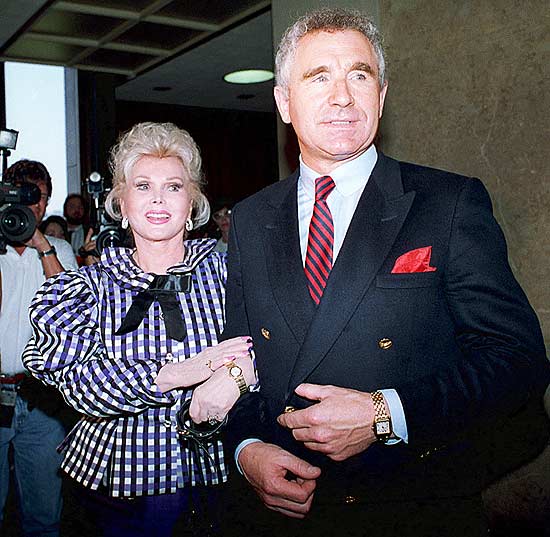 ORG XMIT: 252201_1.tif ** FILE ** Actress Zsa Zsa Gabor and her husband, Frederic von Anhalt, leave court in Beverly Hills, Calif., in this July 13, 1989 file photo. Actress Zsa Zsa Gabor was hospitalized Thursday, Nov. 28, 2002 after her vehicle struck a light pole, officials said. Her husband's spokesman said she was in a coma. (AP Photo/Doug Sheridan, File) 
