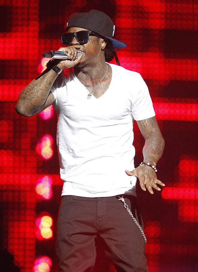 ORG XMIT: NYBUE104 Lil Wayne performs on Friday, March 18, 2011 at the HSBC Arena in Buffalo,NY. (AP Photo/The Buffalo News, Harry Scull Jr)