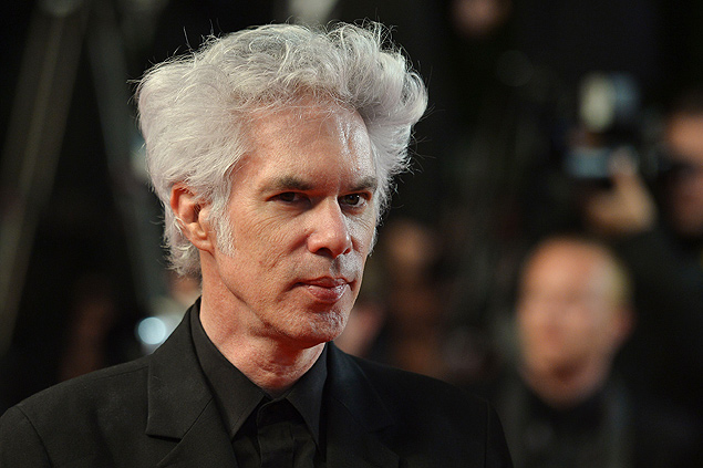 US director Jim Jarmusch poses on May 25, 2013 as he arrives to attend the screening of the film "Only Lovers Left Alive" presented in Competition at the 66th edition of the Cannes Film Festival in Cannes. Cannes, one of the world's top film festivals, opened on May 15 and will climax on May 26 with awards selected by a jury headed this year by Hollywood legend Steven Spielberg. AFP PHOTO / ALBERTO PIZZOLI ORG XMIT: CAN7772