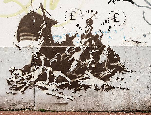 This picture taken on December 12, 2015 shows a street art graffiti by elusive British artist Banksy of the famous painting 'The Raft of the Medusa' (Le radeau de la mduse) by French artist Gericault (1791-1824), in the city centre of Calais, northern France. Banksy has recently painted three graffitis in Calais and substituted the Argus ship by a ferry crossing the Channel. / AFP / PHILIPPE HUGUEN / RESTRICTED TO EDITORIAL USE - MANDATORY MENTION OF THE ARTIST UPON PUBLICATION - TO ILLUSTRATE THE EVENT AS SPECIFIED IN THE CAPTION ORG XMIT: 5225