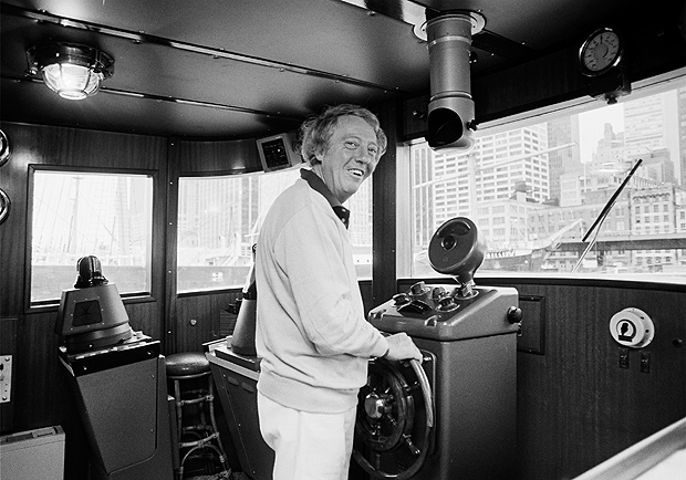 FILE - A Sept. 30, 1979 photo from files of pop impresario Robert Stigwood aboard his yacht Sarina as he readies to sail out of the South Street Seaport in lower Manhattan. Stigwood, who managed the Bee Gees and produced 1970s blockbusters "Grease" and "Saturday Night Fever," has died. He was 81. Stigwood's office said he died Monday, Jan. 4, 2016. The cause of death was not immediately available. (AP Photo/Suzanne Vlamis, File) ORG XMIT: LON101