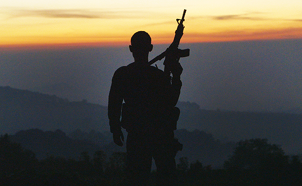 This image released by The Orchard shows an Autodefensa member standing guard in Michoacan, Mexico in a scene from the documentary, "Cartel Land." The film, directed by Matthew Heineman, is nominated for an Oscar for best documentary feature. The 88th annual Academy Awards will take place on Sunday, Feb. 28, at the Dolby Theatre in Los Angeles. (Our Time Projects/The Documentary Group Productions/The Orchard via AP) ORG XMIT: NYET112