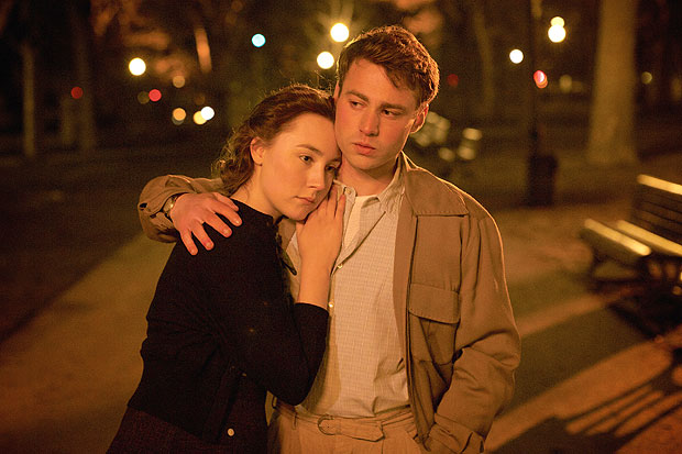 This photo provided by Fox Searchlight shows Saoirse Ronan, left, and Emory Cohen in a scene from the film, 