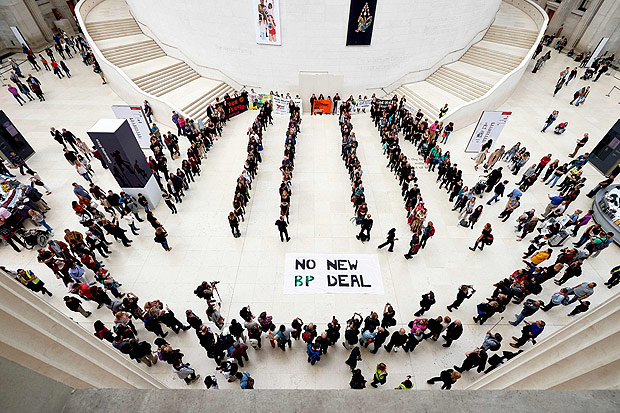 (FILES) This file photo taken on September 13, 2015 shows protesters taking part in a flashmob performance, protesting against British Petroleum's (BP's) sponsorship of the British Museum in central London on September 13, 2015. The theatrical campaign group BP or not BP? occupied the Great Court of the British Museum with what they termed a disobedient exhibition about the Museums controversial sponsor, BP. / AFP PHOTO / NIKLAS HALLE'N ORG XMIT: JR224