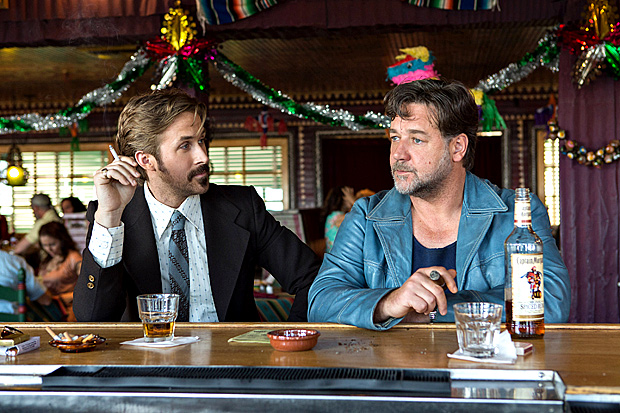 This image released by Warner Bros. Entertainment shows Ryan Gosling, left, and Russell Crowe in a scene from "The Nice Guys."