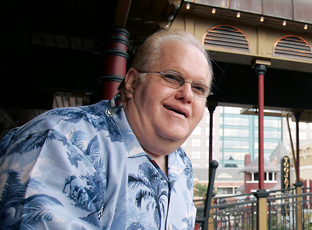 FILE- In this June 27, 2007, file photo Lou Pearlman poses outside his office's at Church Street Station in Orlando, Fla. Pearlman, credited for starting the boy-band craze and launching the careers of the Backstreet Boys and ‘NSync, has died in prison while serving a 25-year sentence for a massive Ponzi scheme. The Orlando Sentinel reported that according to a federal inmate database, the 62-year-old Pearlman died Friday, Aug. 19, 2016. (AP Photo/John Raoux, File) ORG XMIT: NY115