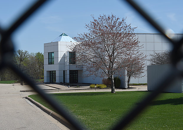 (FILES) This file photo taken on April 22, 2016 shows the entrance of the Paisley Park compound of music legend Prince seen through a fence in Minneapolis, Minnesota.Paisley Park, Prince's state-of-the-art studio complex that held a mythic status for fans who entered it during the pop legend's life, will open to the public as a museum.The 