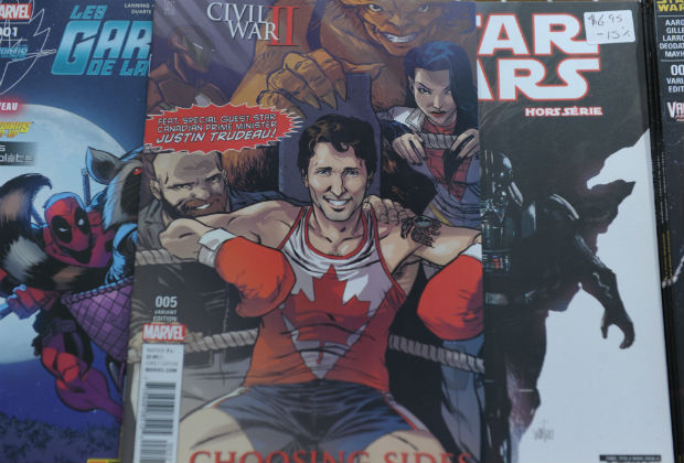 The cover of US publisher Marvel's comic book, featuring Canadian Prime Minister Justin Trudeau as a super hero in front of a newstand in Montreal, Canada on August 31, 2016.Canadian Prime Minister Justin Trudeau takes the role of a superhero in a comic book by US publisher Marvel released on newsstands August 31 in Canada. Trudeau appears smiling in a corner of a boxing ring on the cover of the comic book, a limited edition in English of the series "Civil War II: Choosing Sides" wearing a maple leaf shirt. 