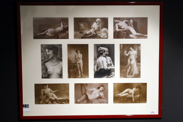 EDITORS NOTE: Graphic content / Ten framed erotic postcards are pictured on November 2, 2016 at the Erotic Museum of Paris prior to the auction sale of the collection on November 6 and the closure of the museum. / AFP PHOTO / PATRICK KOVARIK / RESTRICTED TO EDITORIAL USE -- TO ILLUSTRATE THE EVENT AS SPECIFIED IN THE CAPTION ORG XMIT: 11742