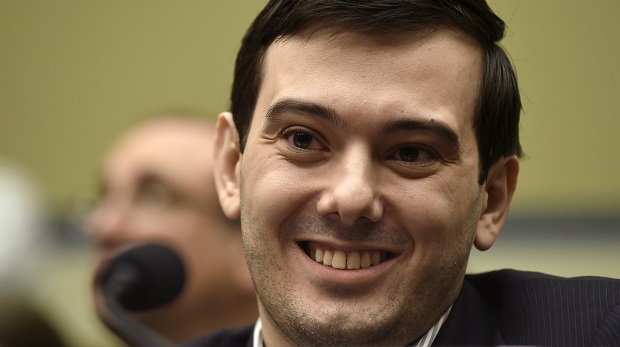 FILE - In this Feb. 4, 2016 file photo, Pharmaceutical chief Martin Shkreli smiles on Capitol Hill in Washington during the House Committee on Oversight and Reform Committee hearing on his former company's decision to raise the price of a lifesaving medicine. President-elect Donald Trump's victory prompted Martin Shkreli on Wednesday, November 9, 2016, to publicly debut some songs off the one-of-a-kind Wu-Tang Clan album he bought for $2 million last year. (AP Photo/Susan Walsh, File) ORG XMIT: PAPM103