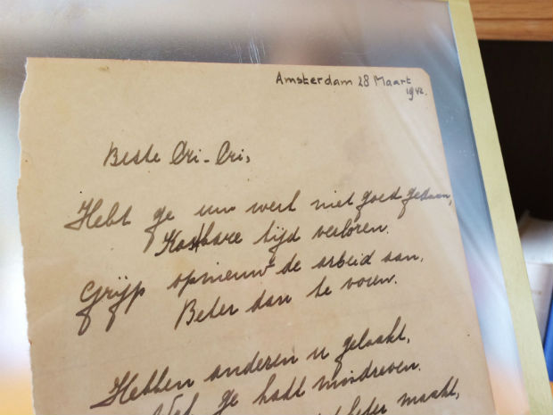 This photo taken on November 21, 2016 at the Bubb Kuyper auction house in Haarlem shows a rare handwritten poem by Anne Frank, penned shortly before she went into hiding from the Nazis, addressed to "Cri-Cri" or Christiane van Maarsen, signed by the Jewish teenager and dated March 28, 1942. An "extremely rare" handwritten poem by Anne Frank, penned shortly before she went into hiding from the Nazis, is to be auctioned on November 23 and could fetch up to 50,000 euros ($55,000), the auctioneers said. The poem was written in the friendship book of the older sister of Anne's best friend, and is signed by the Jewish teenager and dated March 28, 1942, auctioneers Bubb Kuyper said. / AFP PHOTO / Maude BRULARD