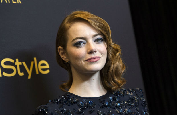 Actress Emma Stone attends the reveal of Miss Golden Globe 2017 during the celebration of the 2017 Golden Globe Award season by The Hollywood Foreign Press Association (HFPA) and InStyle, in West Hollywood, California, on November 10, 2016. / AFP PHOTO / VALERIE MACON ORG XMIT: 01