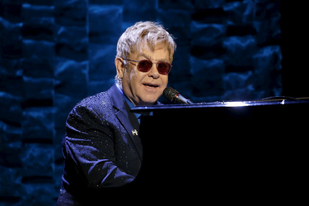Singer Elton John performs at the Hillary Victory Fund 