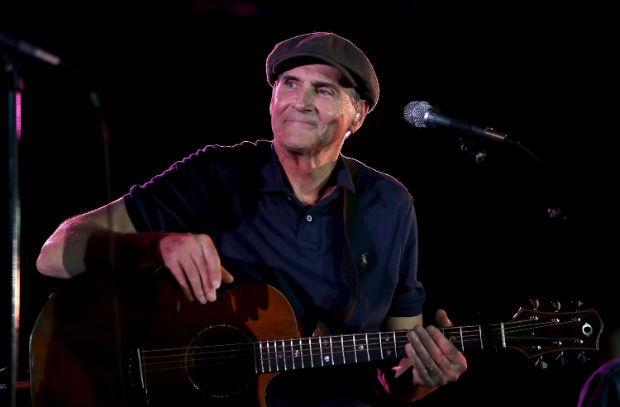 MANCHESTER, NH - NOVEMBER 06: James Taylor performs during a campaign rally for Democratic presidential nominee former Secretary of State Hillary Clinton at The Armory on November 6, 2016 in Manchester, New Hampshire. With two days to go until election day, Hillary Clinton is campaigning in Florida and Pennsylvania. Justin Sullivan/Getty Images/AFP == FOR NEWSPAPERS, INTERNET, TELCOS & TELEVISION USE ONLY ==
