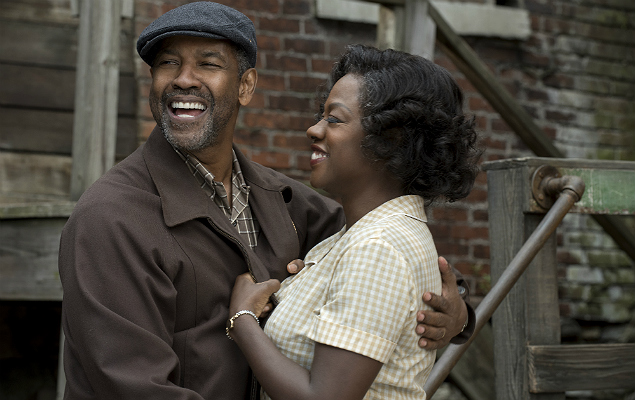 This image released by Paramount Pictures shows Denzel Washington, left, and Viola Davis in a scene from, "Fences." Adapting Wilson's masterpiece has taken more than 30 years. Washington, who directed the film and starred on Broadway revival of "Fences" seven years ago, made some key decisions when he was first tapped to translate the play onto celluloid. He reunited five of the main actors; Viola Davis, Stephen McKinley Henderson, Russell Hornsby and Mykelti Williamson. (David Lee/Paramount Pictures via AP) ORG XMIT: NYET204