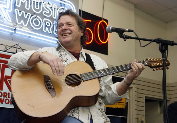  FILE - In this Thursday, April 17, 2008 file photo, John Wetton performs with the band Asia at a music store in New York. Singer and bassist John Wetton of the rock group Asia has died. He was 67. A statement from his publicist, Glass Onyon PR, says Wetton died Tuesday, Jan. 31, 2017 from colon cancer. (AP Photo/Jason DeCrow, file) ORG XMIT: LON120
