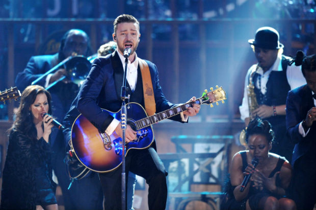Justin Timberlake, center, performs on stage at the American Music Awards at the Nokia Theatre L.A. Live on Sunday, Nov. 24, 2013, in Los Angeles. (Photo by John Shearer/Invision/AP) ORG XMIT: CACJ296