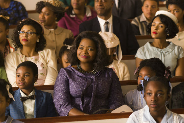This image released by Twentieth Century Fox shows Taraji P. Henson, background left, Octavia Spencer, center, and Janelle Monae, background right, in a scene from "Hidden Figures." (Hopper Stone/Twentieth Century Fox via AP) ORG XMIT: NYET906