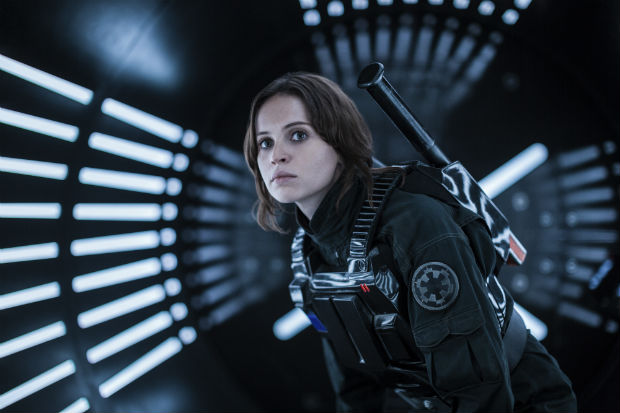 FILE - This file image released by Lucasfilm Ltd. shows Felicity Jones as Jyn Erso in a scene from, "Rogue One: A Star Wars Story." The "Star Wars" spinoff "Rogue One" has led the box office for the third straight week, taking in an estimated $64.3 million over the four-day New Year's weekend. (Jonathan Olley/Lucasfilm Ltd. via AP, File) ORG XMIT: NYAG106