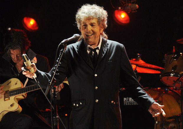 FILE - In this Jan. 12, 2012, file photo, Bob Dylan performs in Los Angeles. Dylan was named the winner of the 2016 Nobel Prize in literature Thursday, Oct. 13, 2016, in a stunning announcement that for the first time bestowed the prestigious award to someone primarily seen as a musician. (AP Photo/Chris Pizzello, File) ORG XMIT: NY204