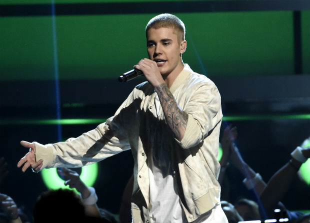 FILE - In this May 22, 2016 file photo, Justin Bieber performs at the Billboard Music Awards in Las Vegas. A Las Vegas man who says Bieber assaulted him in Cleveland eight months ago has filed a police report about the fracas. (Photo by Chris Pizzello/Invision/AP, File) ORG XMIT: NYET341