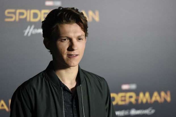  Tom Holland, a cast member in the upcoming film "Spider-man: Homecoming," poses during a photo call backstage of the Sony Pictures Entertainment presentation at CinemaCon 2017 at Caesars Palace on Monday, March 27, 2017, in Las Vegas. (Photo by Chris Pizzello/Invision/AP) ORG XMIT: NVCP112
