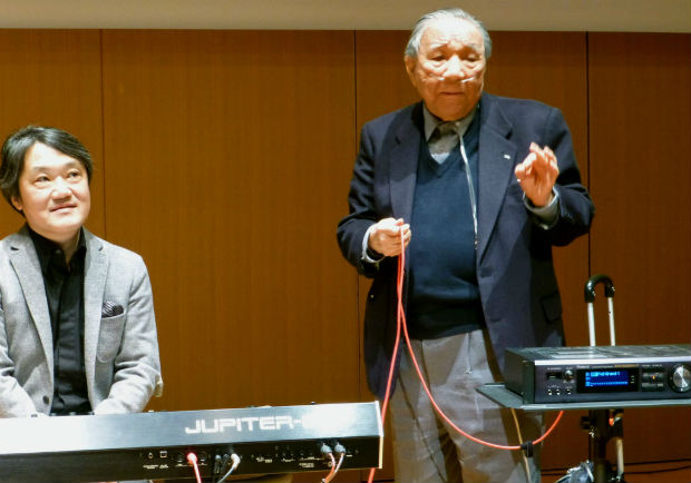 In this Jan. 11, 2013 photo, Ikutaro Kakehashi, right, speaks next to composer Akira Senju during a press conference after he received a Grammy, for developing MIDI, or Musical Instrumental Digital Interface, technology, which digitally connects instruments, in Hamamatsu, central Japan. Kakehashi, who pioneered digital music and founded synthesizer giant Roland Corp., has died, his company ATV Corp. said Monday, April 3, 2017. He was 87. (Kyodo News via AP) ORG XMIT: TKSK802
