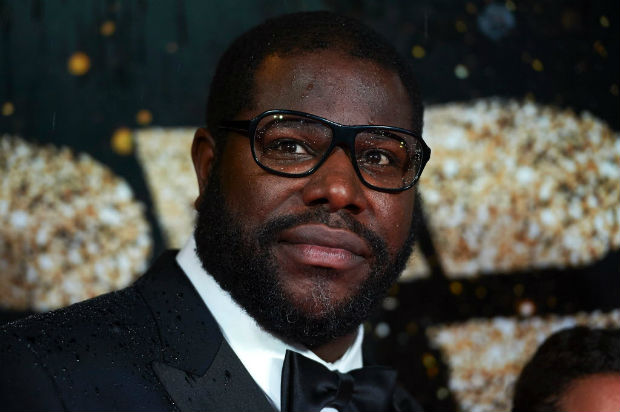 (FILES) This file photo taken on October 15, 2016 shows British director Steve McQueen on the red carpet as he arrives for the BFI London Film Festival Awards in central London. Steve McQueen, who won an Oscar for directing "12 Years a Slave," will film an authorized documentary on slain rap legend Tupac Shakur.The British director said he was "extremely moved" to explore Tupac's life, saying he had known him indirectly while studying in New York in 1993."Few, if any, shined brighter than Tupac Shakur," McQueen said in a statement late May 9, 2017. / AFP PHOTO / Niklas HALLE'N