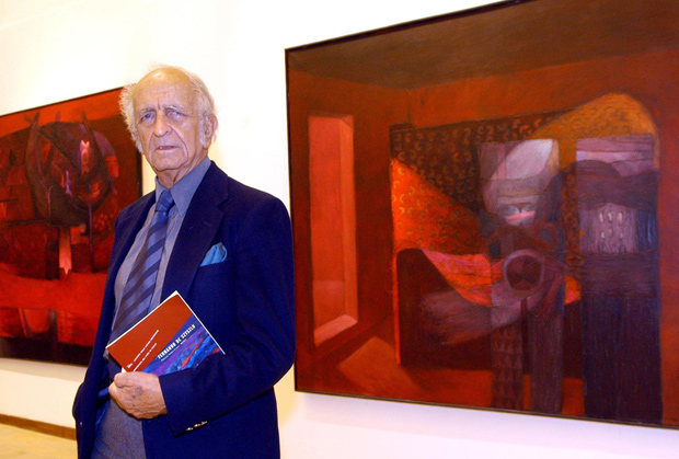 ORG XMIT: 381401_1.tif Famous Peruvian painter Fernando de Szyszlo, one of the main artists of abstract art in South America, poses in front of two out of 16 huge paintings exhibited in a Rome art gallery, 20 February 2004. AFP PHOTO/ Victor SOKOLOWICZ 