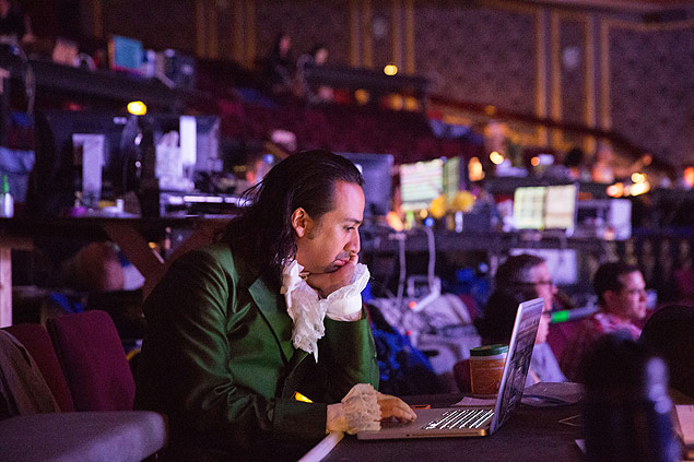 Lin-Manuel Miranda works at his computer while on break from rehearsal of the musical 