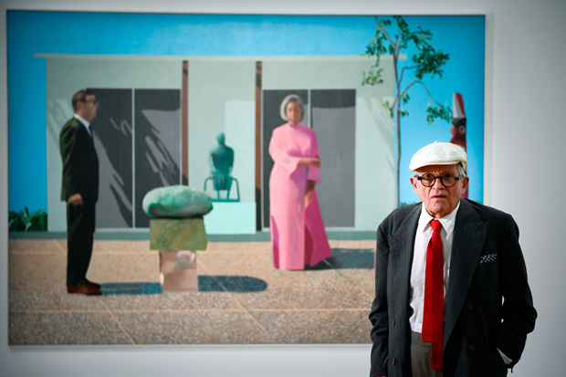 British artist David Hockney poses in front of his painting "Fred and Marcia Weisman" during a photo session at the Pompidou Centre in Paris, on June 16, 2017. / AFP PHOTO / Martin BUREAU / RESTRICTED TO EDITORIAL USE - MANDATORY MENTION OF THE ARTIST UPON PUBLICATION - TO ILLUSTRATE THE EVENT AS SPECIFIED IN THE CAPTION
