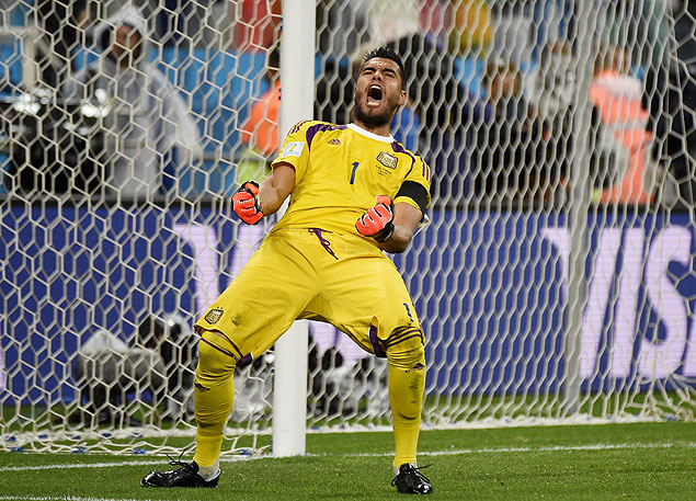 Argentina's goalkeeper Sergio Romero reacts after saving a penalty 