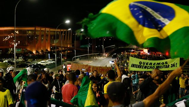 Demonstrators protest in front of the Planalto Palace