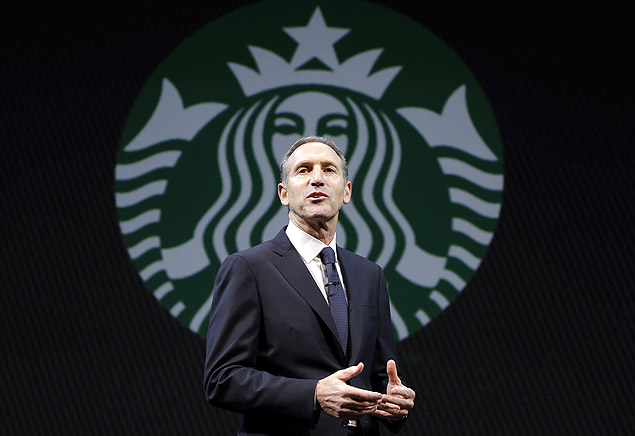 ORG XMIT: WATW101 Starbucks CEO Howard Schultz speaks at the company's annual shareholders meeting, Wednesday, March 20, 2013, in Seattle, Wash. (AP Photo/Ted S. Warren)