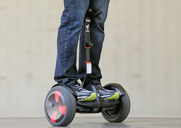 FILE - In this May 27, 2016, file photo, company representative Zach Servideo demonstrates Segway's new self-balancing scooter, the MiniPro, in downtown Los Angeles. Despite associations with fires and falls, the MiniPro comes across as a good way to make public transit more accessible if you arent near a subway station or bus stop. (AP Photo/Reed Saxon, File) ORG XMIT: NYBZ305