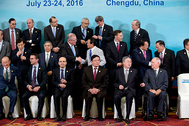 G20 Finance Ministers and Central Bank Governors prepare for a group photo session in Chengdu in Southwestern China's Sichuan province, Sunday, July 24, 2016. Finance Ministers and Central Bank Governors of the 20 most developed economies met in the southwestern city of Chengdu ahead of a G20 leaders meeting in September hosted by China. Participants in the front row are, from left are: World Bank President Jim Yong Kim, an unidentified member, Turkey's Deputy Prime Minister Mehmet Simsek, China's Finance Minister Lou Jiwei, China's People's Bank of China Governor Zhou Xiaochuan and Germany's Federal Minister of Finance Wolfgang Schauble. (AP Photo/Ng Han Guan, Pool) ORG XMIT: XHG106