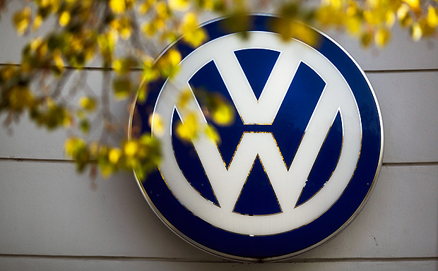 FILE - In this Oct. 5, 2015, file photo, the VW sign of Germany's Volkswagen car company is displayed at the building of a company's retailer in Berlin. Volkswagen Truck & Bus, an arm of the German automaker Volkswagen, is buying a minority stake in Navistar. The two companies also said Tuesday, Sept. 6, 2016, that they will enter a procurement joint venture that will help source parts for both businesses. (AP Photo/Markus Schreiber, File) ORG XMIT: NY108
