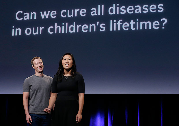 In this Tuesday, Sept. 20, 2016, photo, Facebook CEO Mark Zuckerberg, left, and his wife, Priscilla Chan, rehearse for a speech in San Francisco. Zuckerberg and Chan have a new lofty goal: to cure, manage or eradicate all disease by the end of this century. To this end, the Chan Zuckerberg Initiative, the couple's philanthropic organization, is committing significant financial resources over the next decade to help accelerate basic science research. (AP Photo/Jeff Chiu) ORG XMIT: CAJC303
