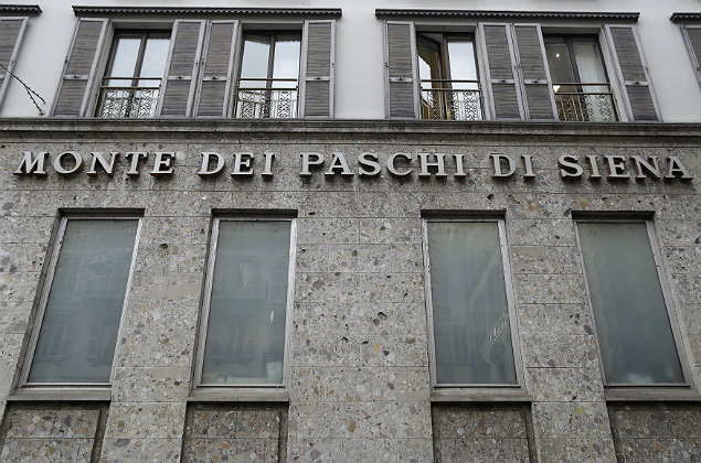 In this file photo dated Monday, Dec. 19, 2016, the facade of a branch of the ' Monte Dei Paschi di Siena ' bank in Milan, Italy. In a statement issued late Monday Dec. 27, 2016, the European Central Bank estimates the Monte Dei Paschi di Siena bank will need more rescue money than previously expected. (AP Photo/Antonio Calanni, FILE) ORG XMIT: LON103