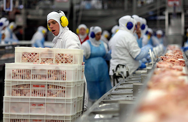 Workers prep poultry at the meatpacking company JBS, in Lapa, in the Brazilian state of Parana, Tuesday, March 21, 2017. Brazil's president said Tuesday that a scandal over sale of expired meat is an 