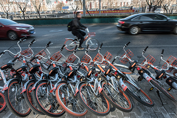 FILE -- A stack of bike-share bicycles in Beijing, March 1, 2017. Buoyed by the success of car and bike-sharing companies and fueled with ready cash, Chinese startups are entering what some consider a sharing bubble, including items such as umbrellas and basketballs. (Gilles Sabrie/The New York Times)