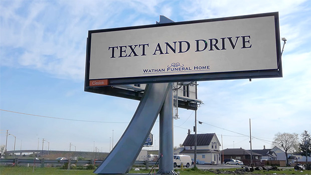 Fake funeral home billboard tells people to text and drive