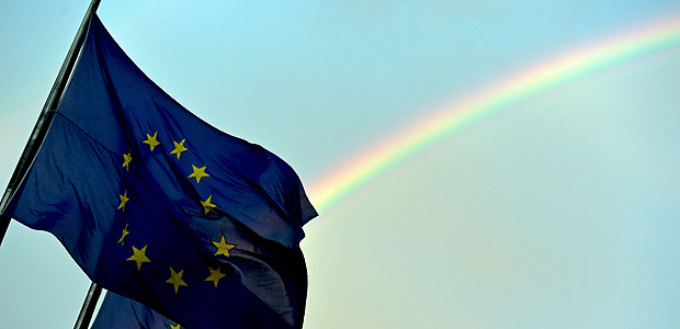A rainbow is seen behind European flags during a euro zone EU leaders emergency summit on the situation in Greece at the European Council headquarters in Brussels, Belgium, July 7, 2015. REUTERS/Eric Vidal ORG XMIT: EVD39